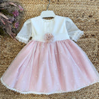 Abito battesimo rosa cipria per neonata con fiore centrale

