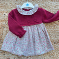 Abito bimba rosso bordeaux floreale con parte superiore in maglia e gonna fantasia