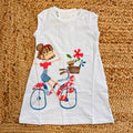 abito bimba cotone bianco con bambina bicicletta
