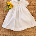 Abito bimba elegante in lino bianco con gonna ampia