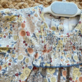 Abito pagliaccetto bimba floreale Yoedu con punto smock e pagliaccetto coordinato