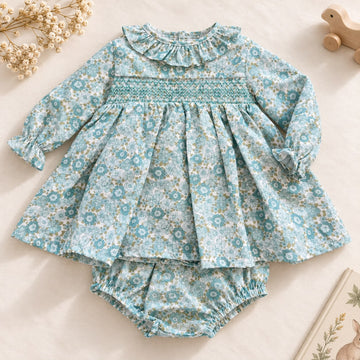 Abito bimba floreale verde acqua in cotone con colletto arricciato e punto smock