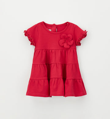 Abito bimba color fragola con fiore applicato e gonna a balze