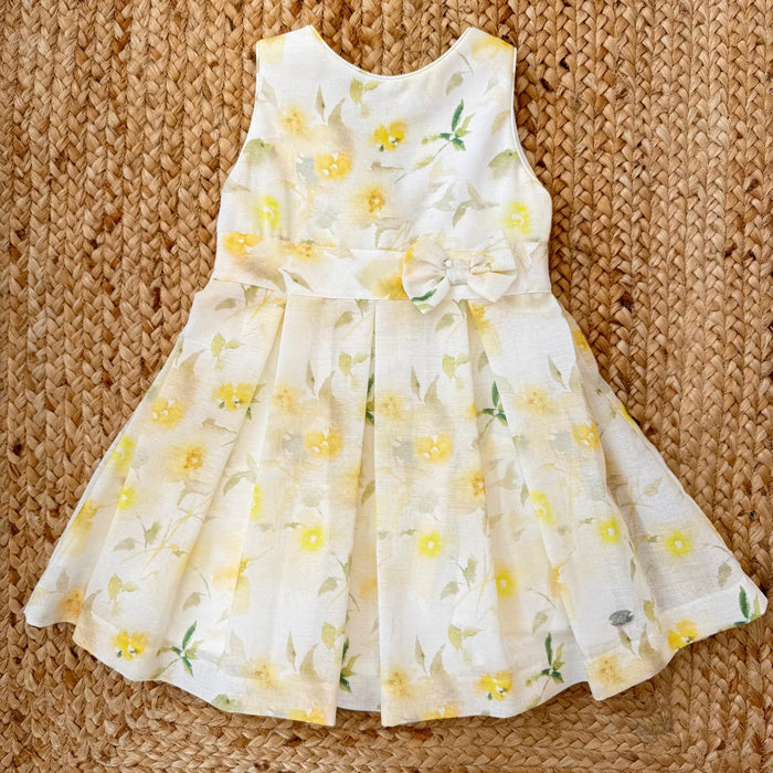 abito bimba panna con fiori gialli elegante