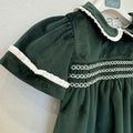 Abito bimba primo compleanno in velluto verde bottiglia con punto smock e colletto panna