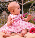 Abito bimba primo compleanno rosa con fantasia floreale e gonna ampia