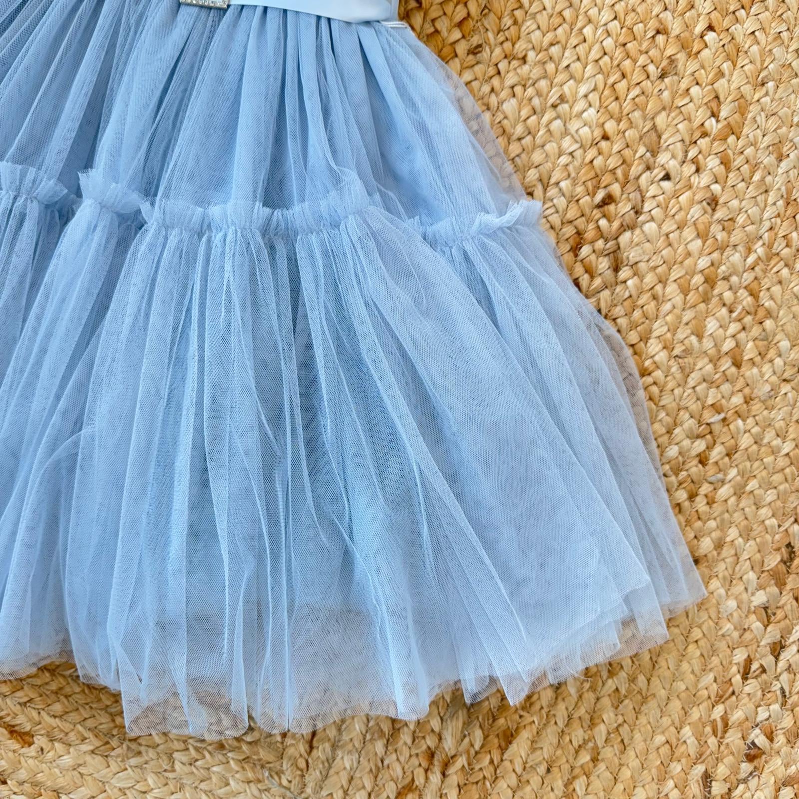 abito bimba ampio in tulle azzurro polvere