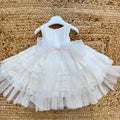 dettaglio tulle e pizzo ricamato vestito battesimo