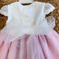 Maxi fiocco in organza sul retro dell’abito da cerimonia
