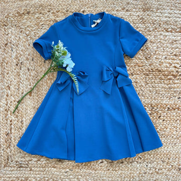 abito bambina blu elegante con fiocchi laterali e gonna svasata
