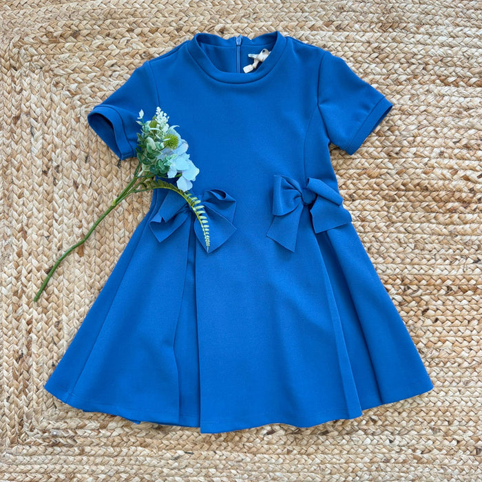 abito bambina blu elegante con fiocchi laterali e gonna svasata