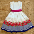abito bimba elegante con cintura fucsia vista frontale