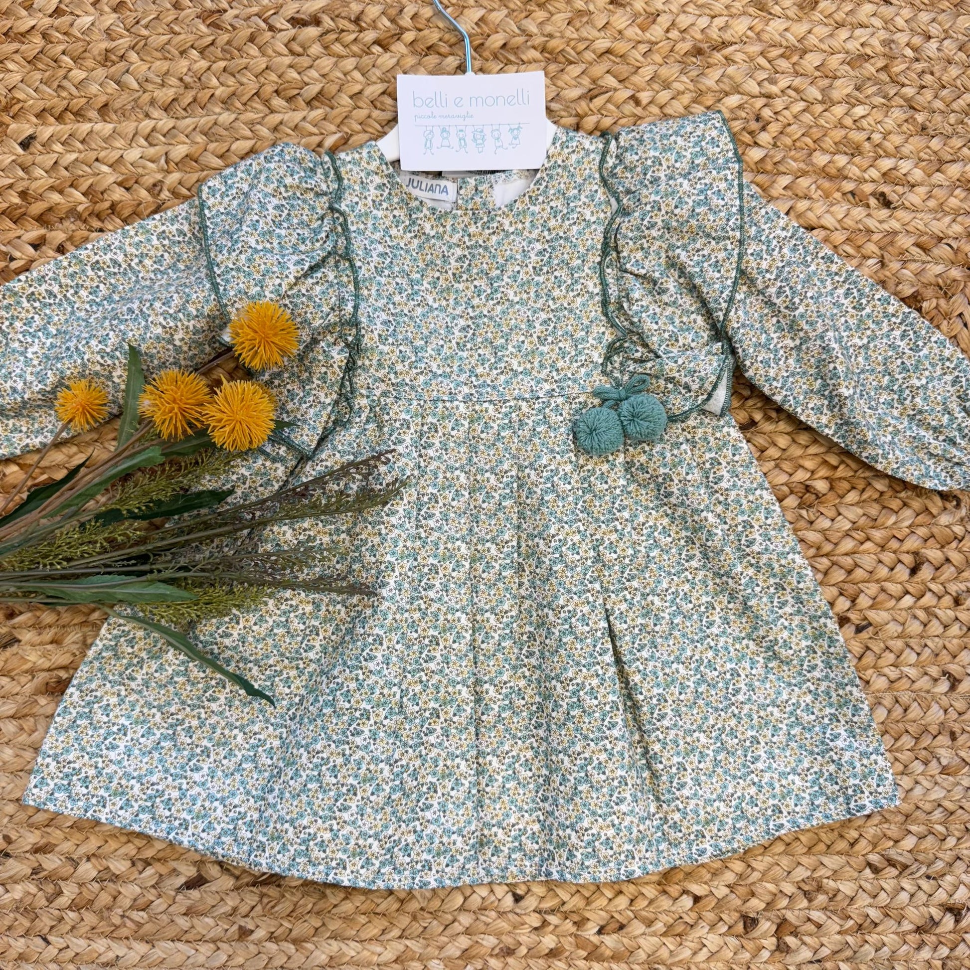 abito elegante bimba floreale verde con volant e pon pon