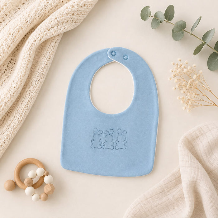 Bavaglino neonato panna con ricamo orsetto e scritta Dolce Amore, accessorio elegante per corredino nascita.