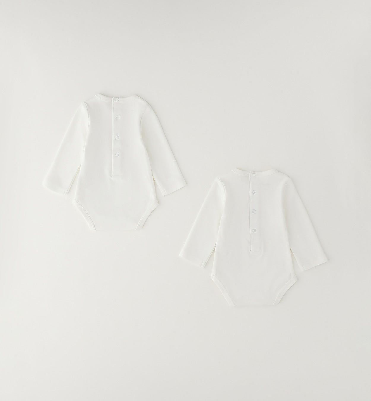Bipack body unisex in caldo cotone panna a manica lunga con delicate decorazioni per neonato