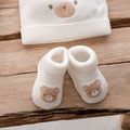 Calzine neonato unisex in caldo cotone color panna con orsetto beige applicato per corredino nascita