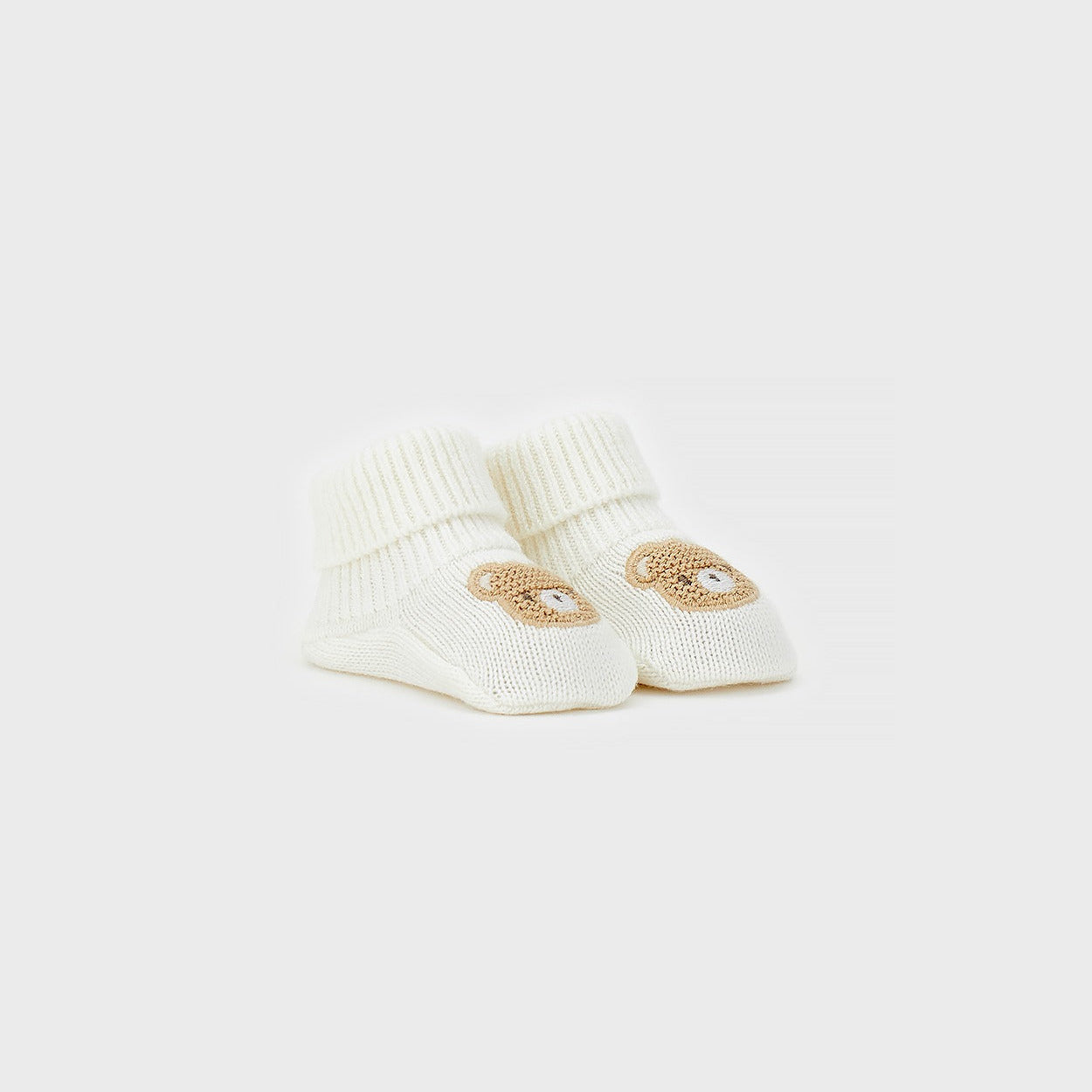 Calzine neonato unisex in caldo cotone color panna con orsetto beige applicato per corredino nascita