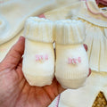 Uscita clinica neonata in pura lana con copertina latte e rosa confetto Made in Italy.