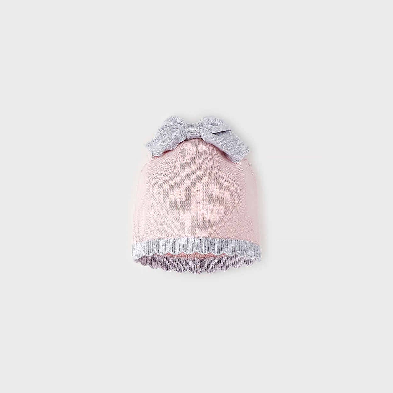 Cappellino neonata rosa in cotone e lana con fiocco a contrasto e bordo coordinato