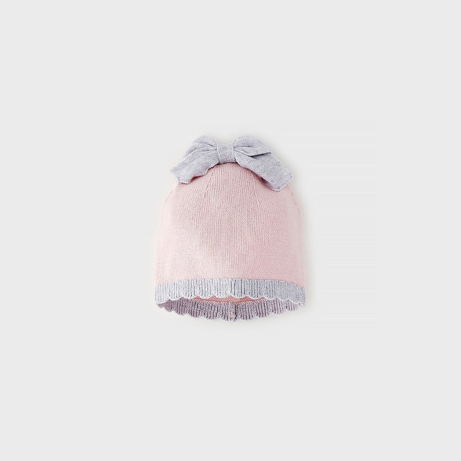 Cappellino neonata in cotone e lana rosa con fiocco