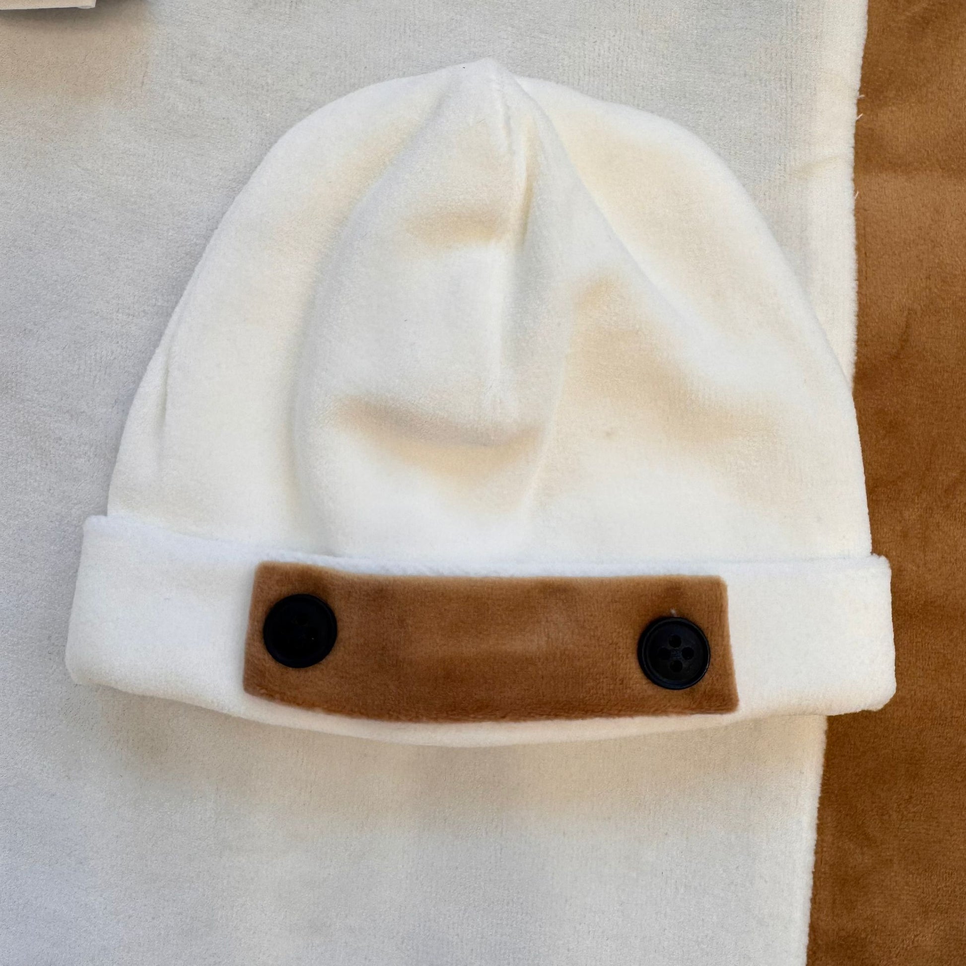 cappellino-neonato-ciniglia-panna.