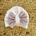 cappellino neonata rosa in ciniglia con fiocco centrale
