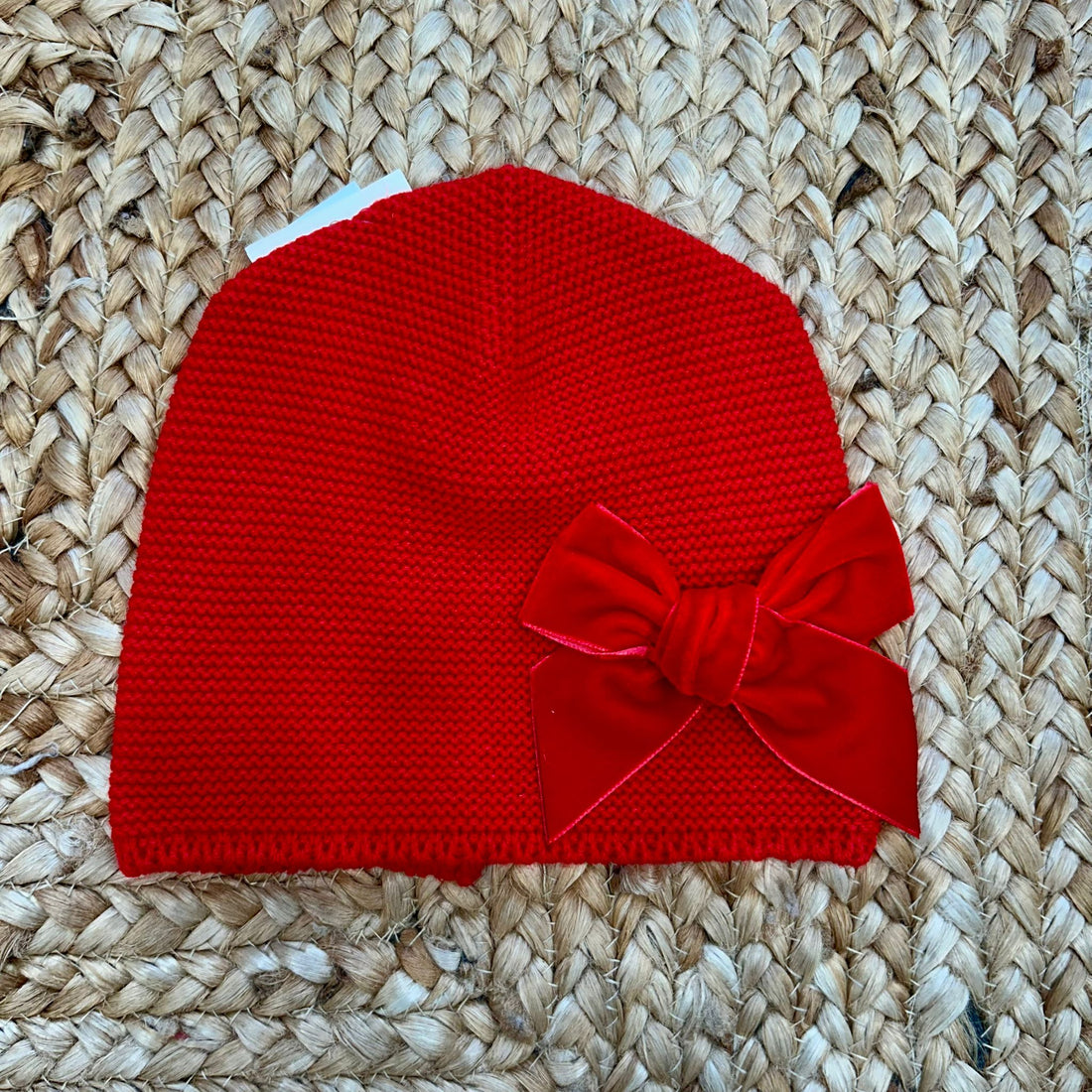 cappellino rosso Condor in maglia con fiocco in velluto per bambina
