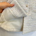 Cappottino elegante bimba bouclé panna con colletto floreale dorato e bottoni effetto perla