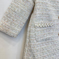 Cappottino elegante bimba bouclé panna con colletto floreale dorato e bottoni effetto perla