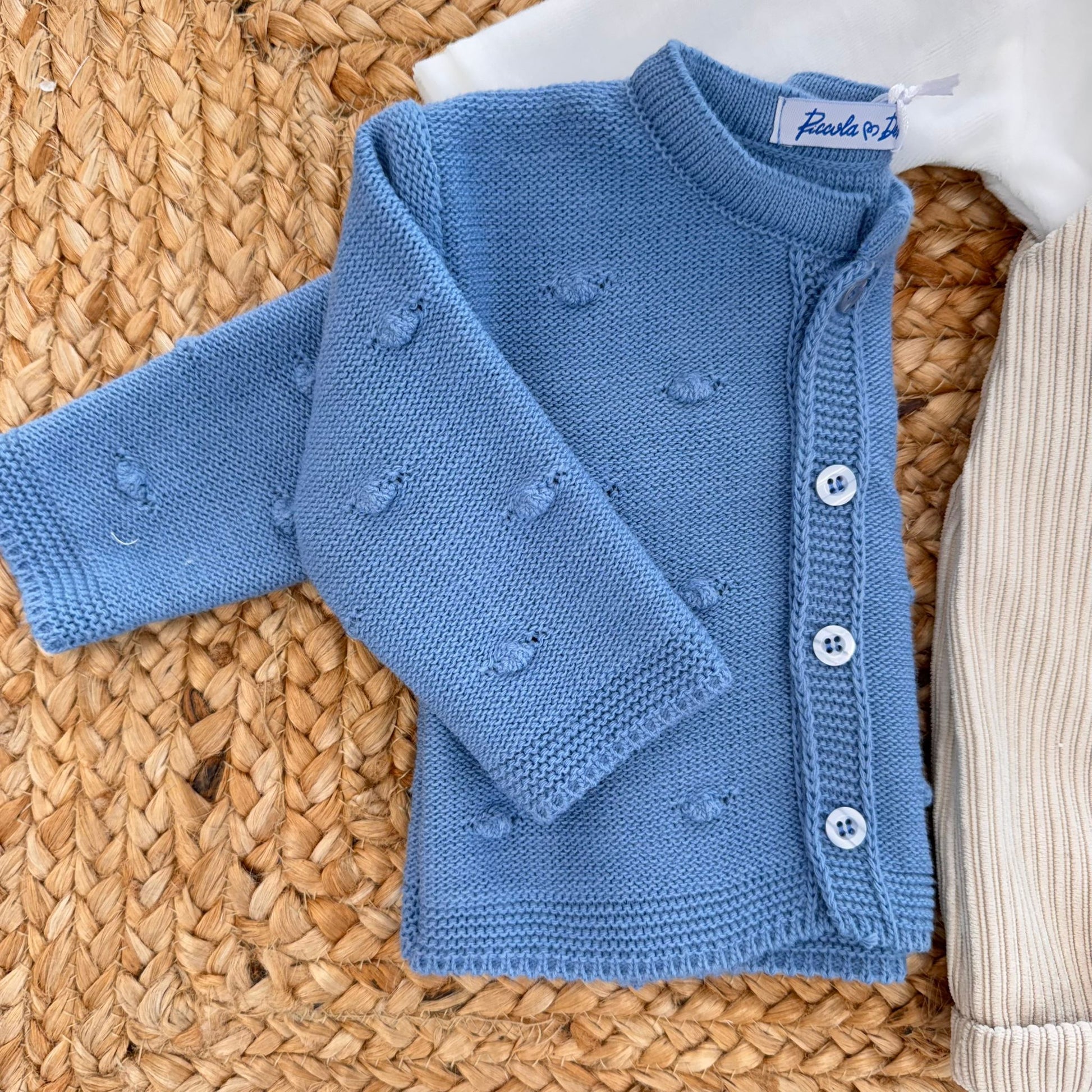 Cardigan azzurro neonato con lavorazione a nocciolina