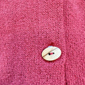 Cardigan bimba in 100% cotone color mattone con ampio colletto e bottoni