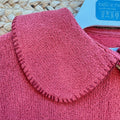 Cardigan bimba in 100% cotone color mattone con ampio colletto e bottoni