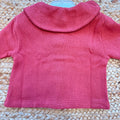 Cardigan bimba in 100% cotone color mattone con ampio colletto e bottoni