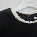Abito elegante bambina nero con tre maxi fiocchi avorio e maniche a palloncino