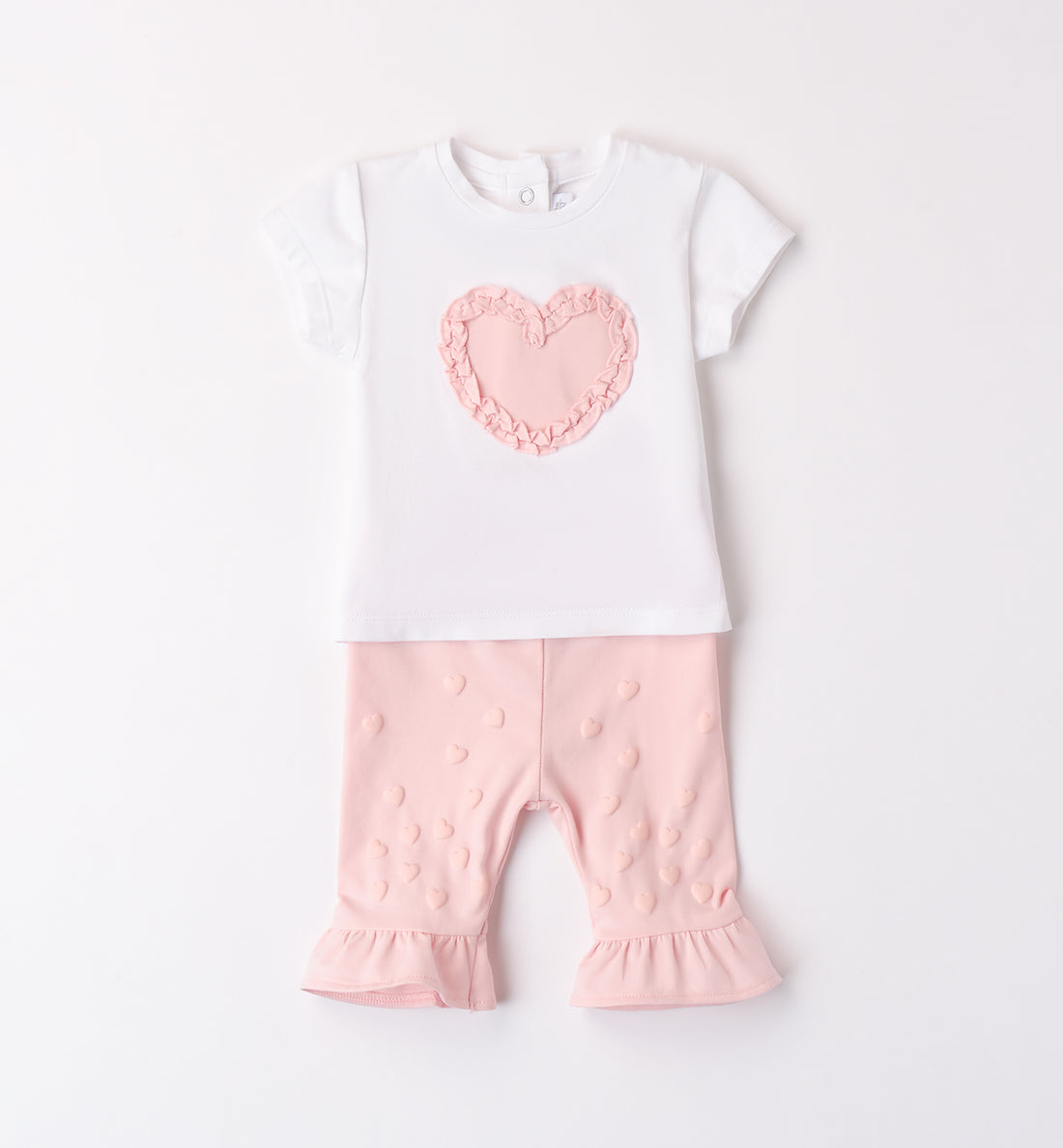 Completo bambina in cotone con t-shirt bianca e leggings rosa con dettagli cuoricini.