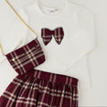 Completo bimba 3 pezzi con maglia bianca, gonna tartan bordeaux e borsetta coordinata