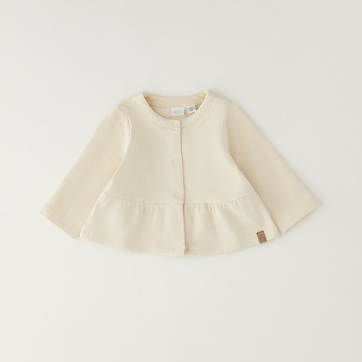 Giacca bimba in caldo cotone color panna con balza e chiusura frontale