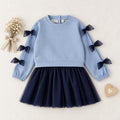 Completo bimba azzurro e blu con maglia con fiocchi e gonna in tulle