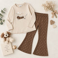 Completo bimba 100% cotone con maglia beige stampa cagnolino e pantalone marrone fantasia fiocchetti