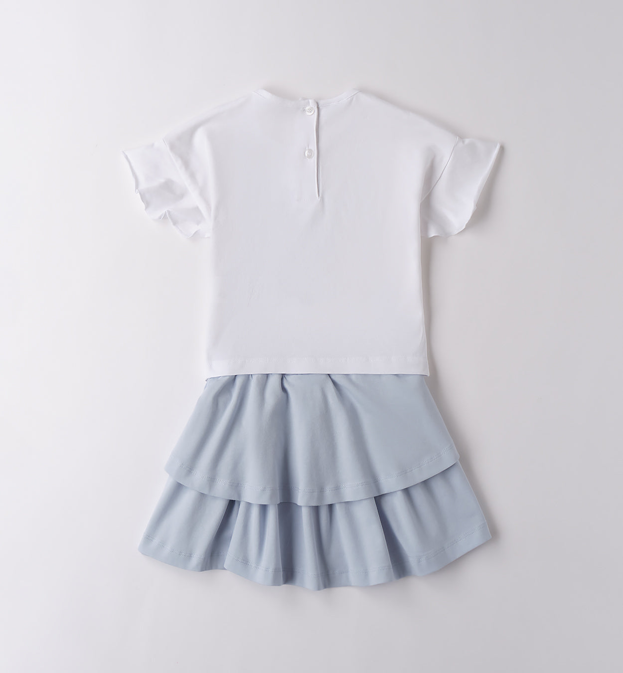 Retro completo bimba: t-shirt con apertura a bottoncino e gonna a doppia balza.