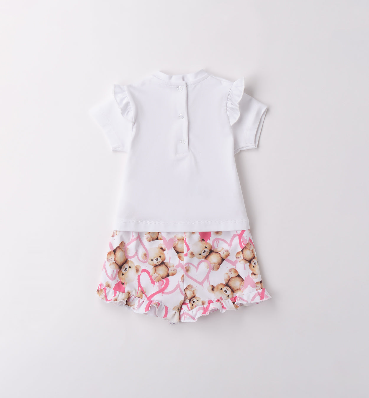  Retro completo bimba con maglietta a bottoncini e pantaloncini stampati con balze.

