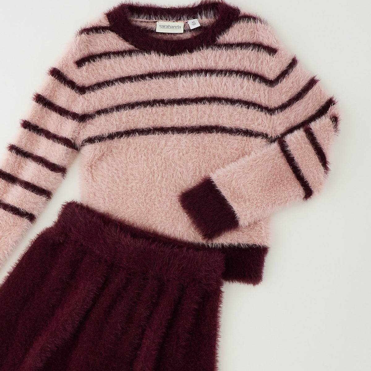 Completo bimba rosa e bordeaux effetto peluche con gonna