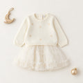 	Completo elegante bimba avorio con maglioncino a cuori e gonna in tulle dorato