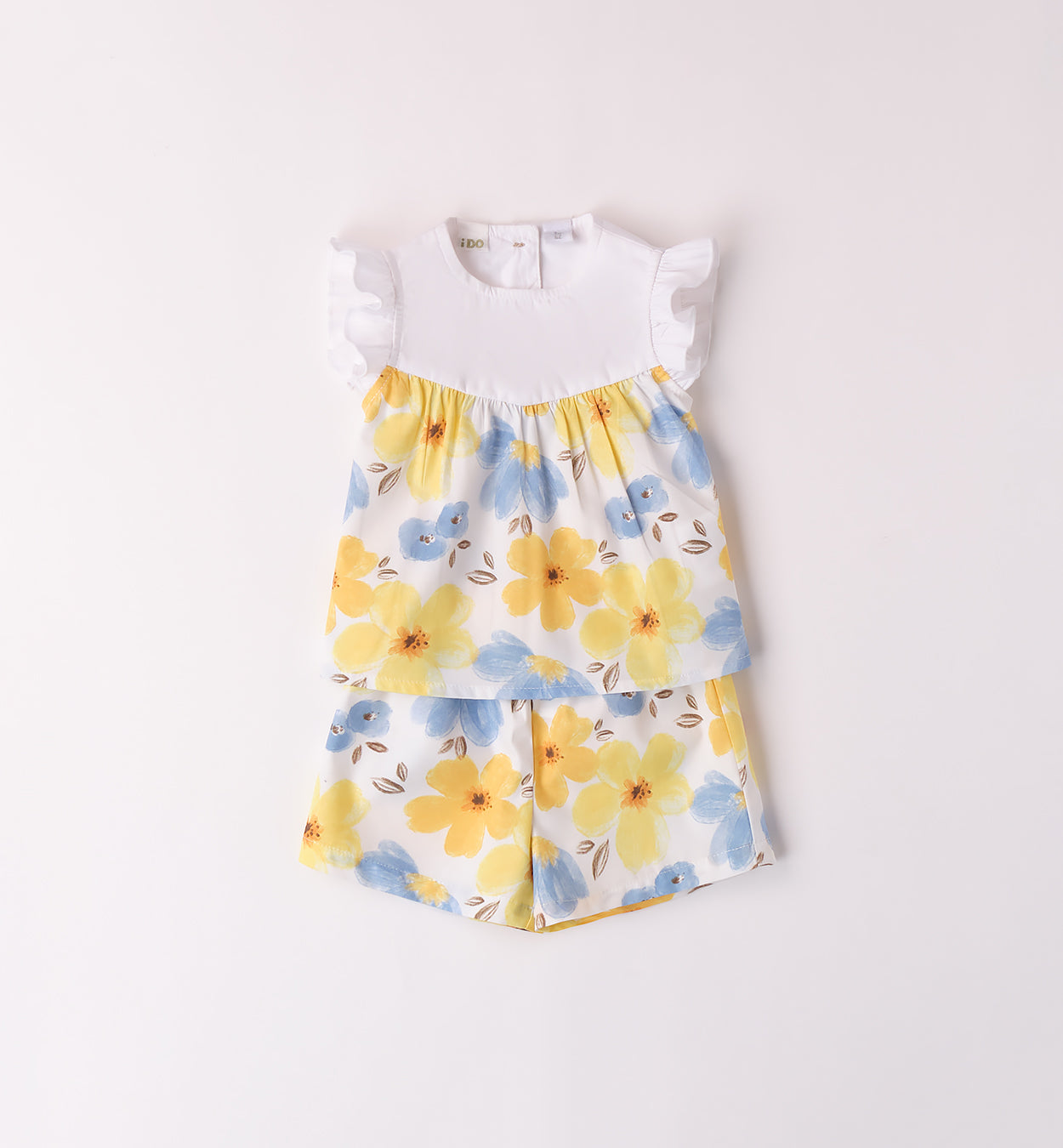 Completo estivo per bambina con stampa floreale nei toni del giallo e del blu, retro con bottoncini e volant sulle spalle.