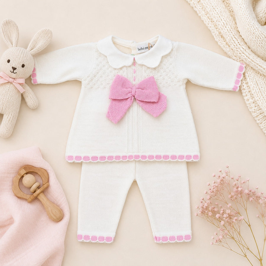 Tutina neonata in misto lana con maxi fiocco rosa