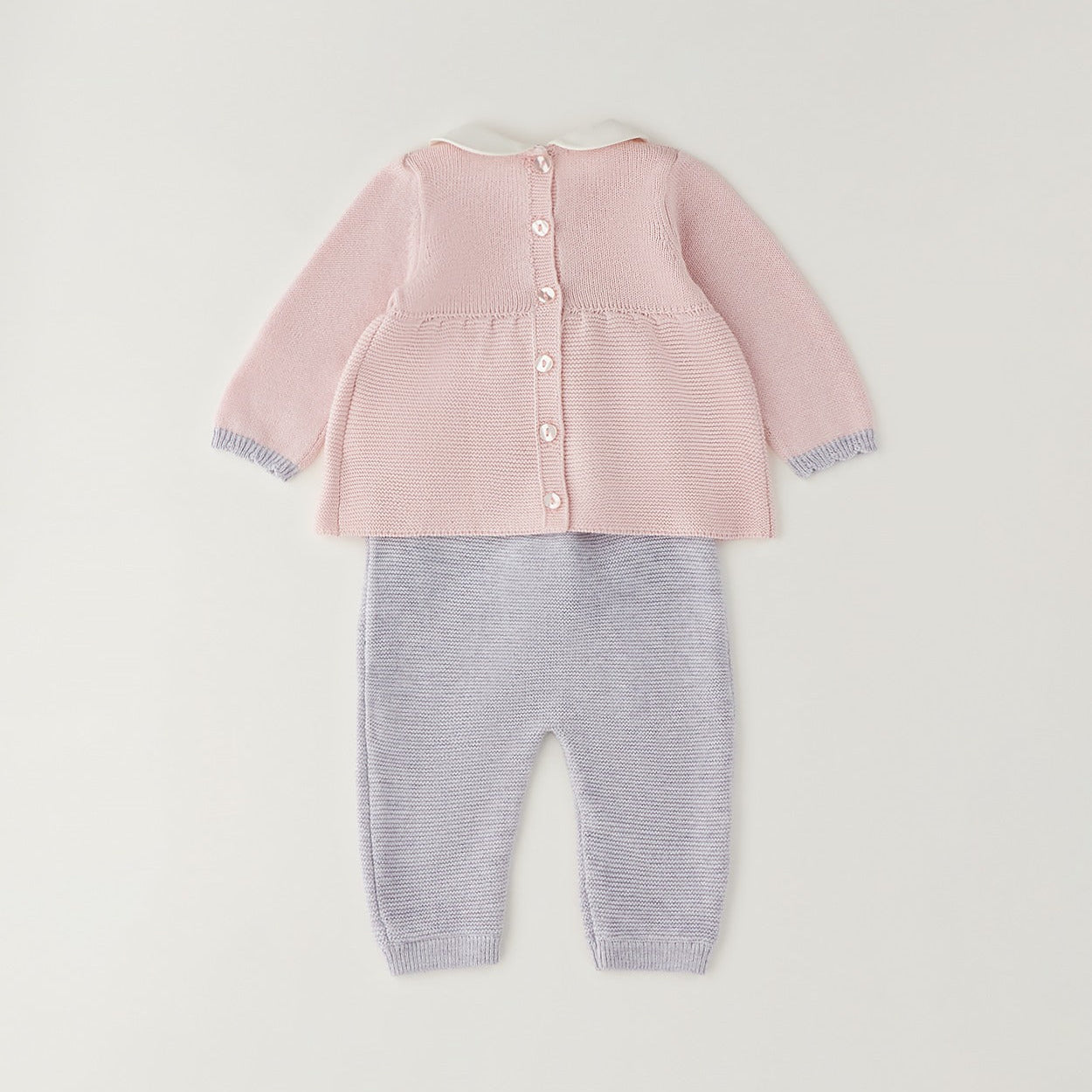 Completo neonata rosa e grigio in cotone e lana con fiocco, pantalone e cappellino coordinato.