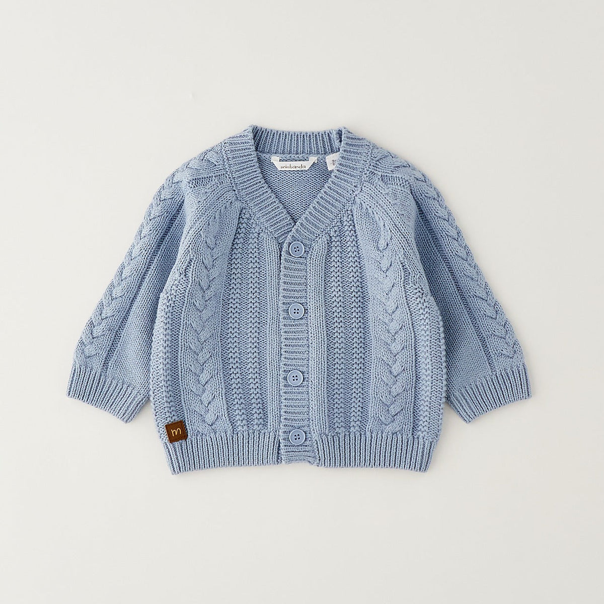 Cardigan neonato azzurro in cotone e lana con lavorazione a trecce e bottoni