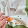 Uscita clinica neonato in pura lana latte pistacchio salvia e beige.