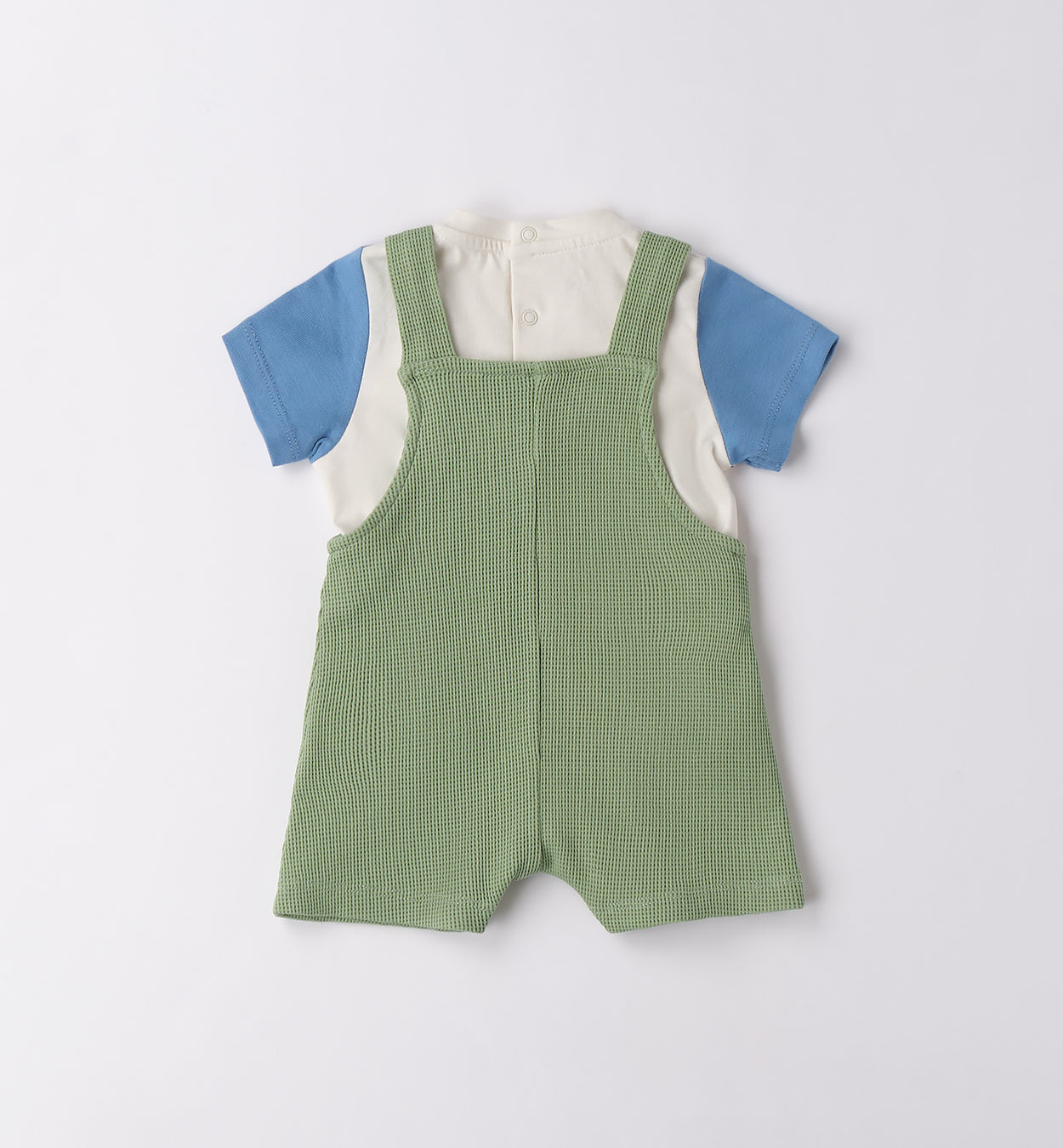 Retro salopette neonato in maglina verde con t-shirt a maniche corte colorate.