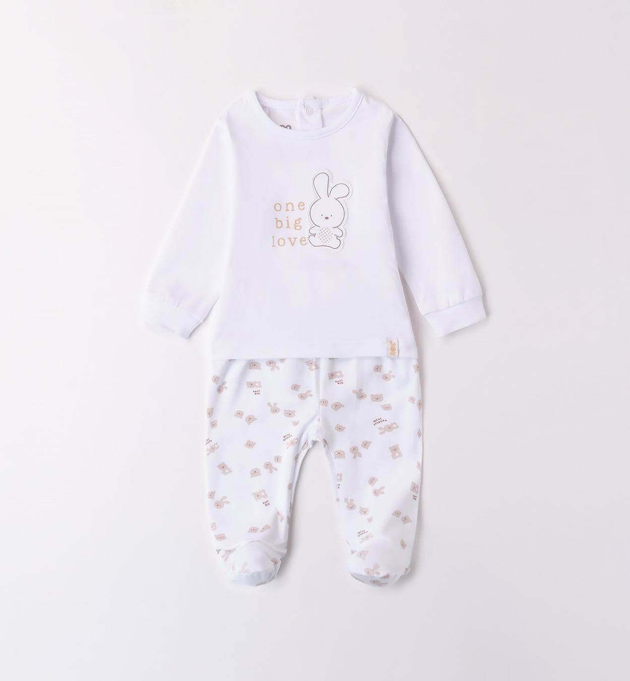  Retro della blusa con bottoncini e pantaloni con piedini coperti.